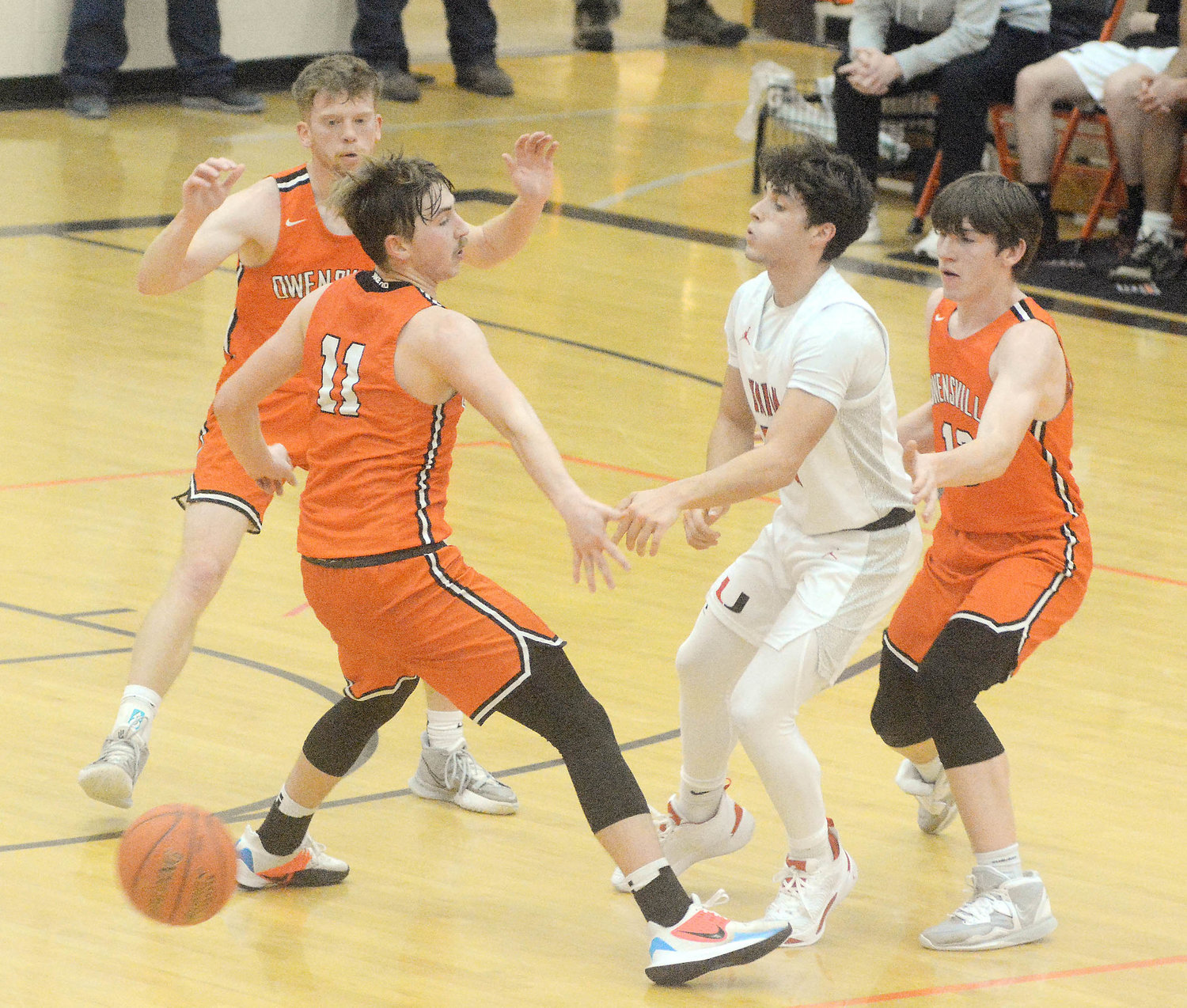 Bryce Payne, Charlie Whelan and Layne Evans (above, from left) surround Union’s Ryan Rapert just as the Wildcat guard passes the ball during first-round action Monday night during first-round action from the 34th Owensville Varsity Boys Basketball Tournament at Owensville High School. Games continued last night (Tuesday) with semifinal action set for Thursday and all four place games on Friday beginning at 4 p.m.